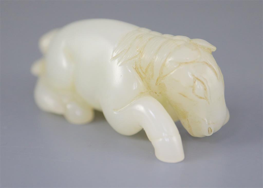 A Chinese white jade group of a recumbent horse and boy, 6cm long